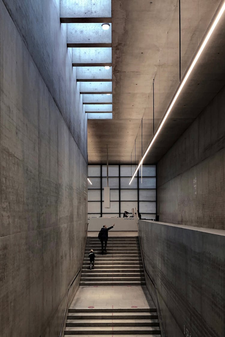 Visitors On Concrete Staircase Of The James Simon Gallery In Berlin