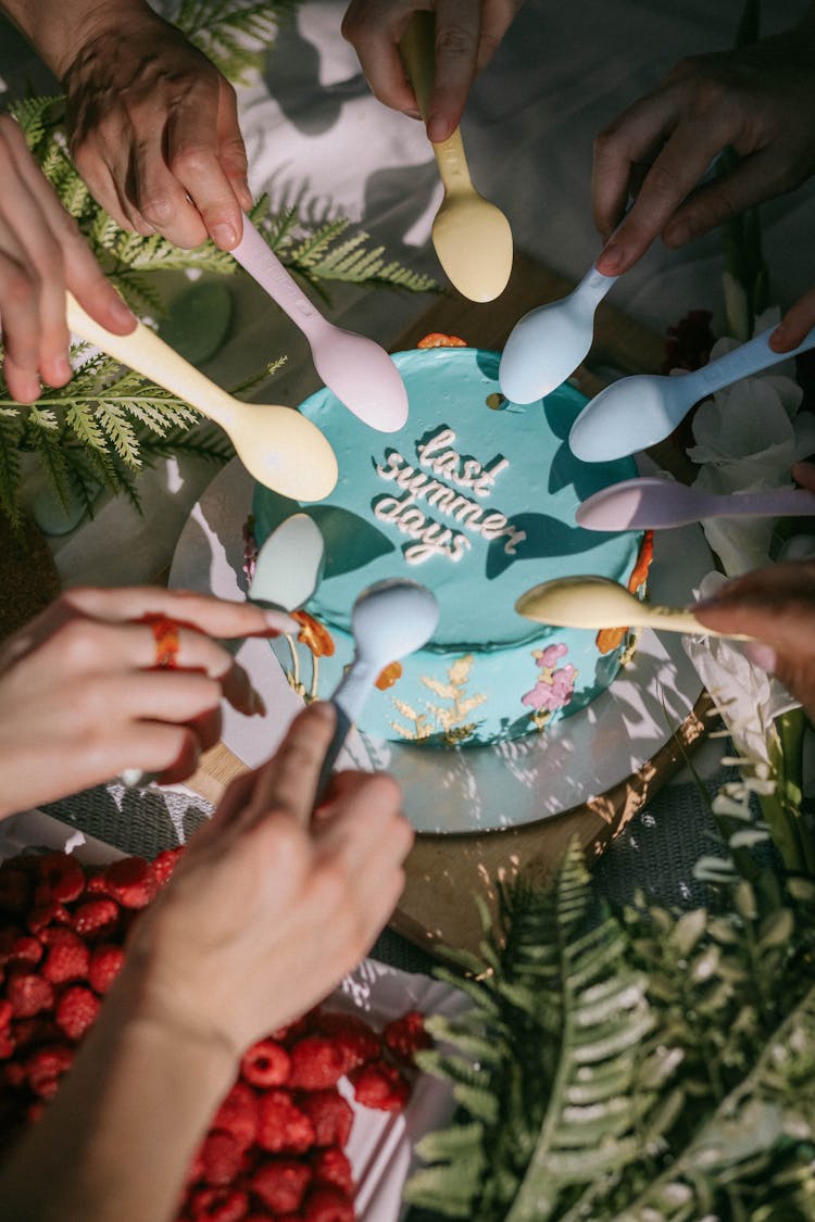 People Tasting Cake On A Party