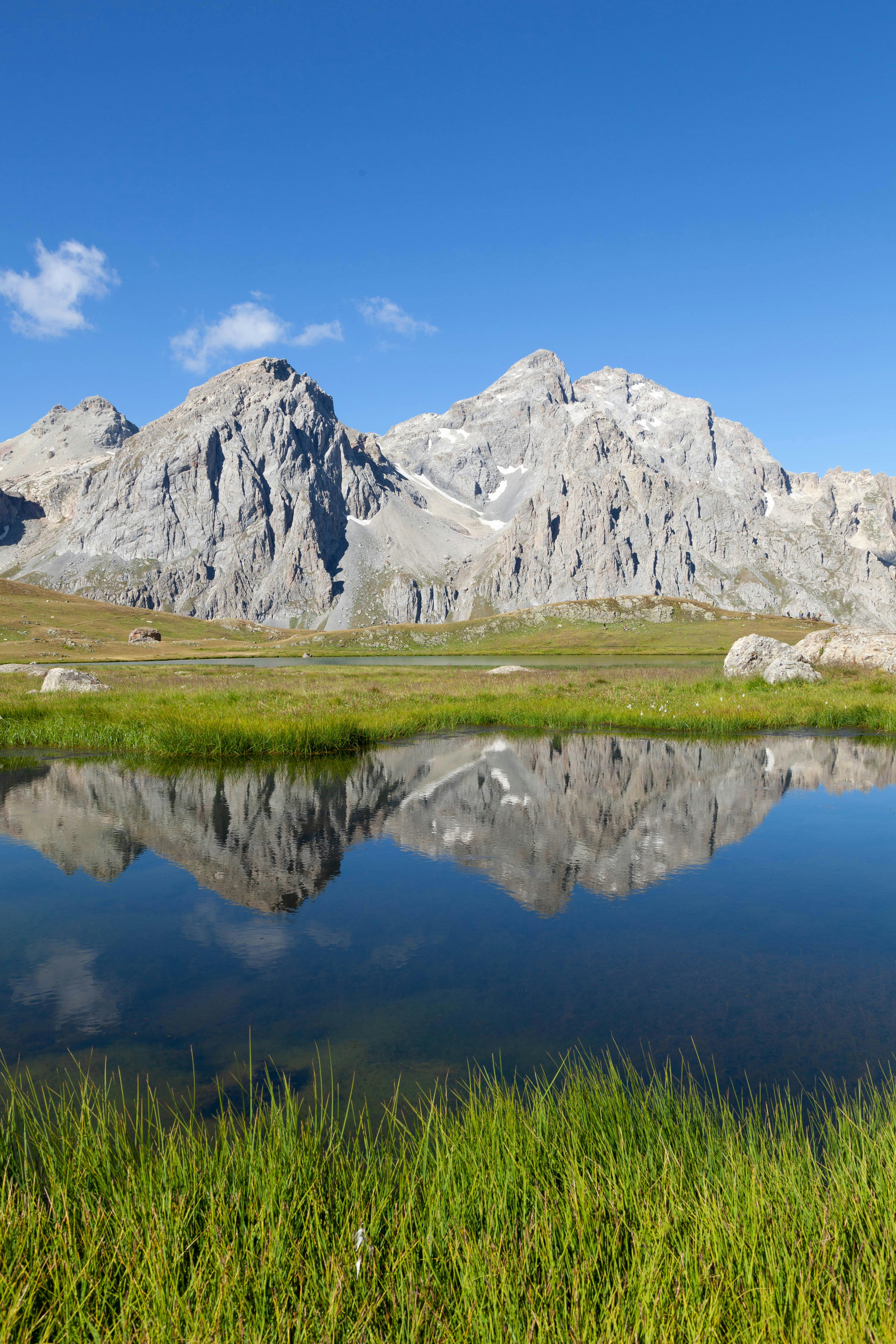 a mountain range with a small lake in the middle