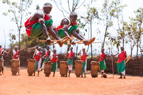 Men in Traditional Clothing at Festival in Village