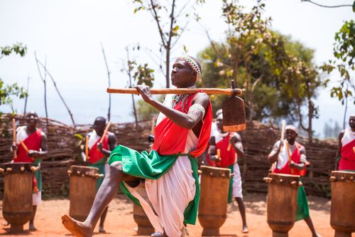 Free A vibrant outdoor performance featuring traditional African drummers and dancers in colorful attire. Stock Photo