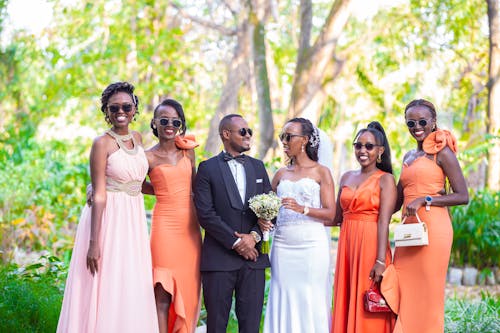 Smiling Newlyweds with Bridesmaids