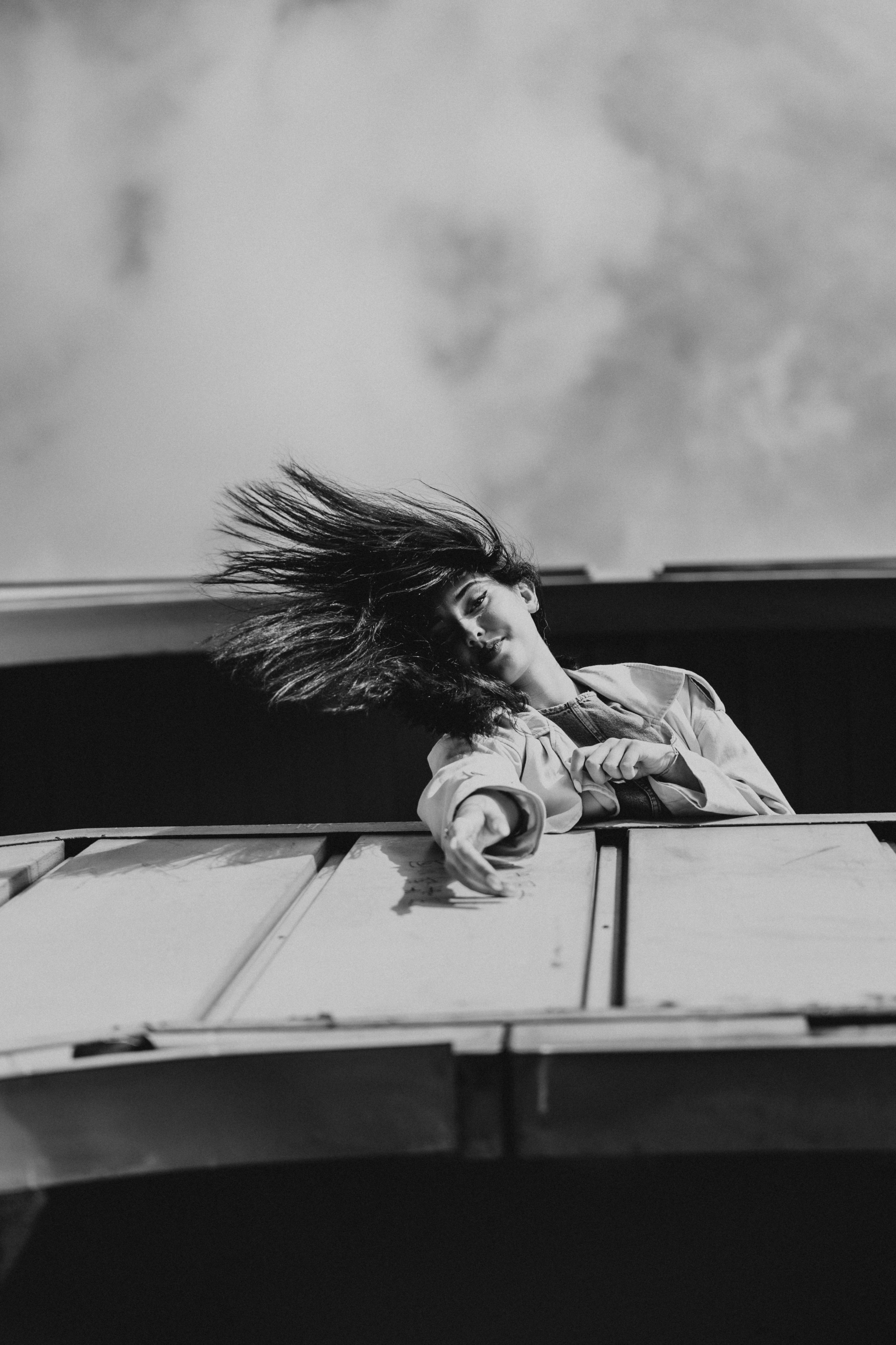 A woman with her hair blowing in the wind · Free Stock Photo