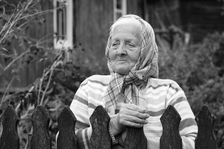 A Woman Standing In A Garden 