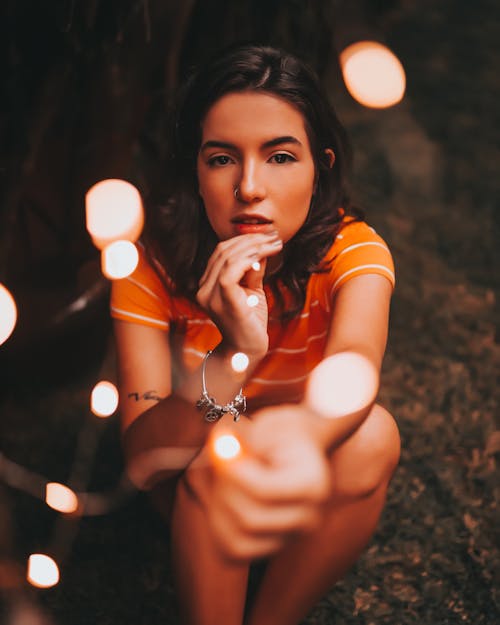 Free Woman Sitting While Touching Chin Stock Photo