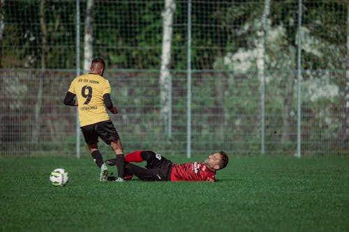 Men Playing Soccer Game