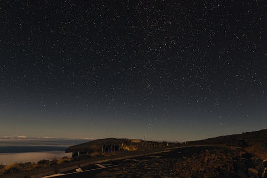 Stunning nightscape of La Palma's sky with stars illuminating a serene landscape.