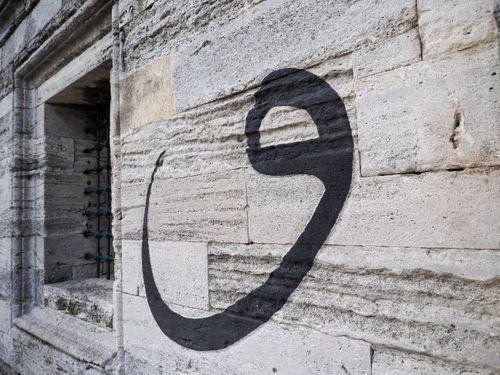 Free Ottoman calligraphy on an ancient stone wall in Istanbul, showcasing cultural heritage. Stock Photo