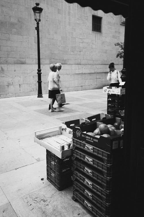 Free Boxes with Fruits Near Booth on Street Stock Photo
