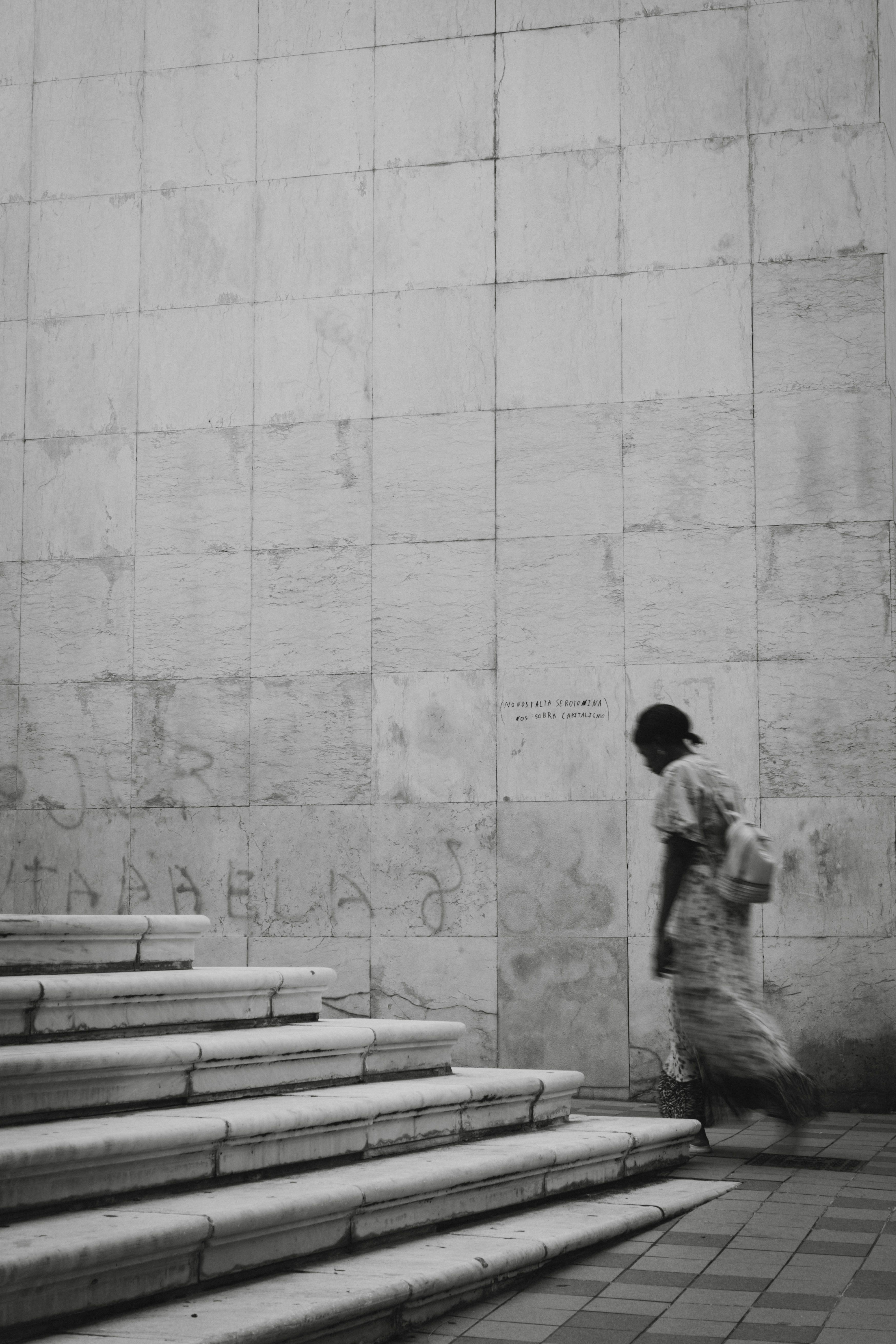 Woman Walking near Stairs and Wall · Free Stock Photo