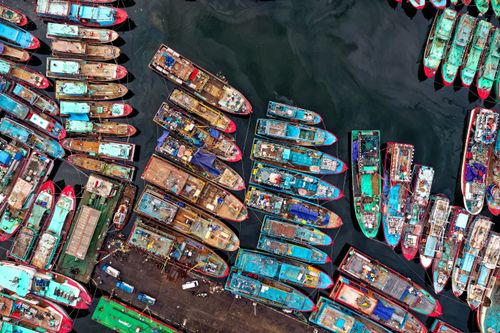Free Colorful boats clustered at Penjaringan dock in Jakarta, captured from an aerial perspective. Stock Photo