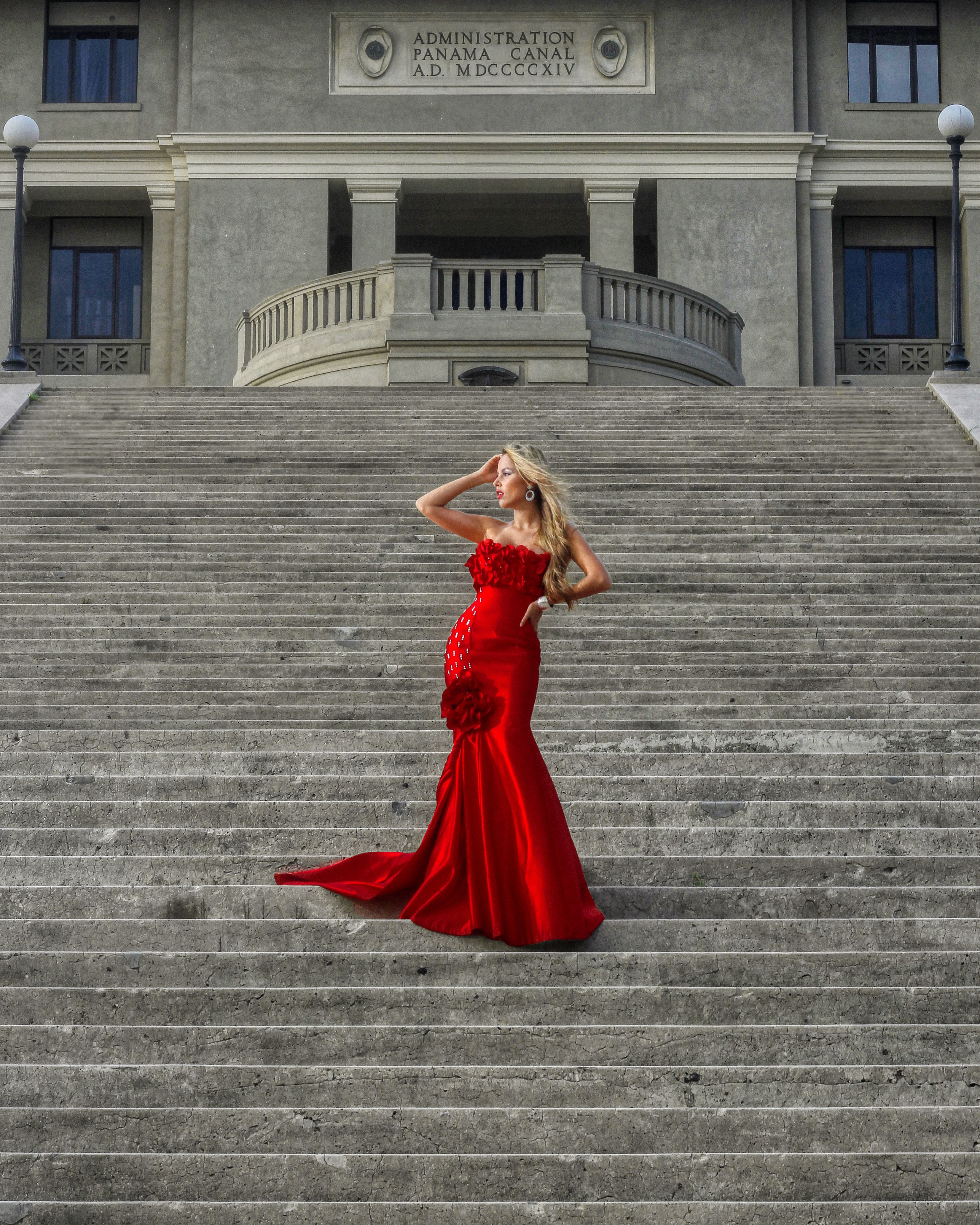 Woman Wearing Red Dress Posing on Stairs · Free Stock Photo