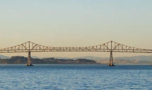 Free Scenic view of the Richmond-San Rafael Bridge across San Francisco Bay at twilight. Stock Photo
