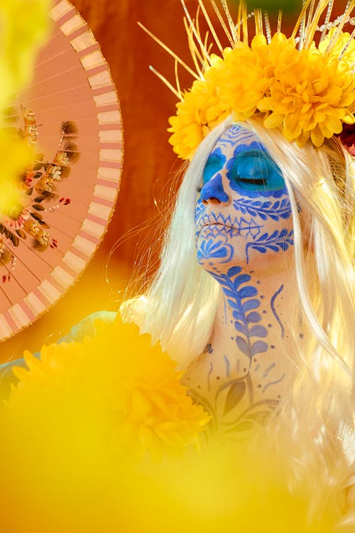 Portrait of a Long-Haired Blonde Wearing a Floral Pattern Face Paint