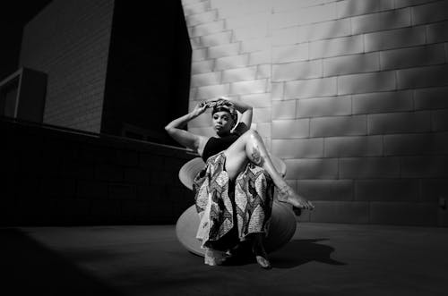 Barefoot Model in Skirt Sitting and Posing in Black and White