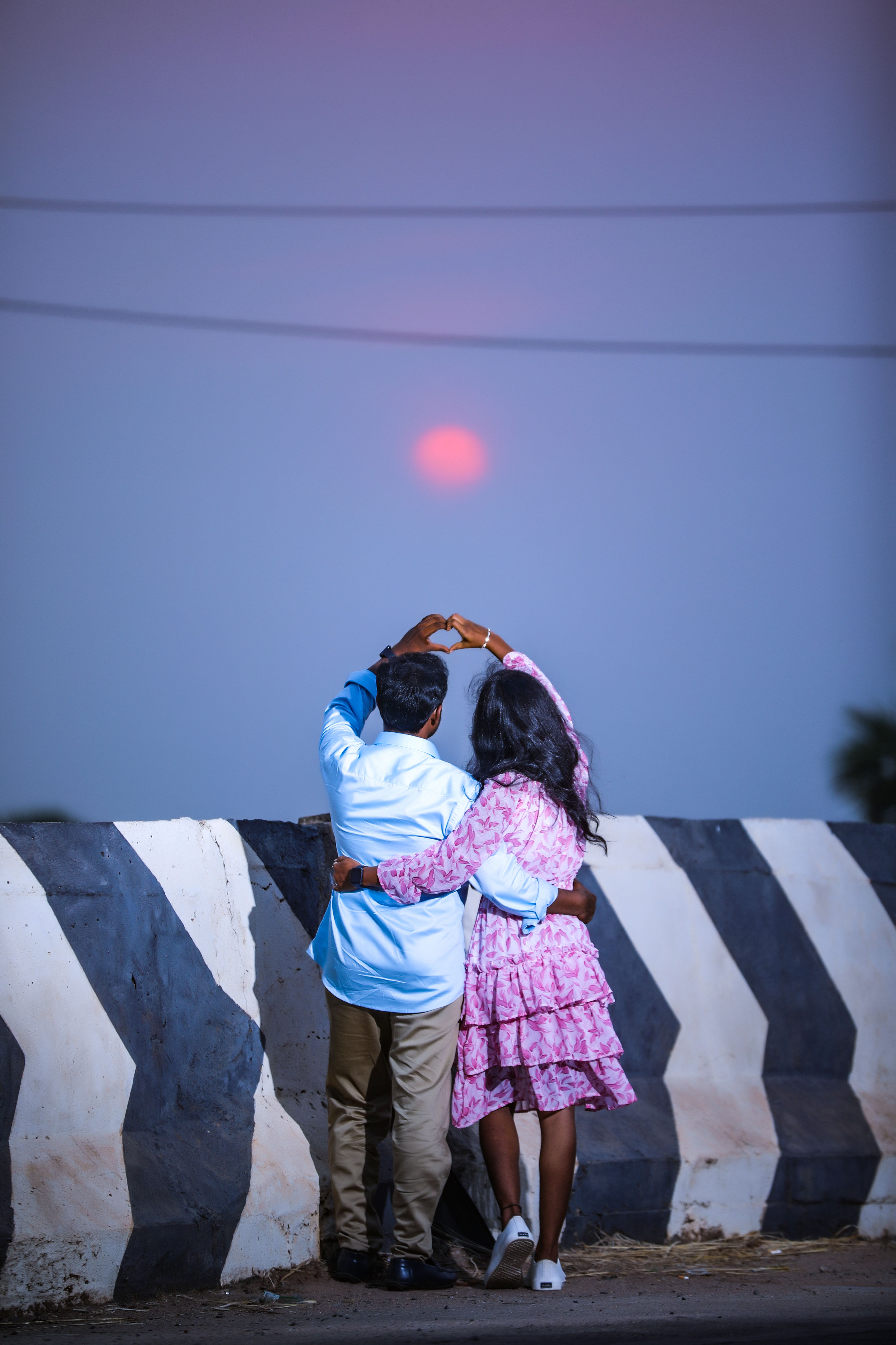 Back View of a Couple Standing Outside and Making a Heart with Their ...