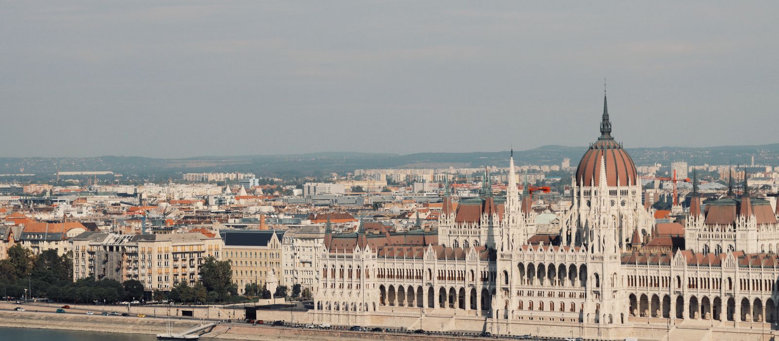 Scenic view of the iconic Hungarian Parliament Building along the Danube River in Budapest. — flights from Amman to Budapest