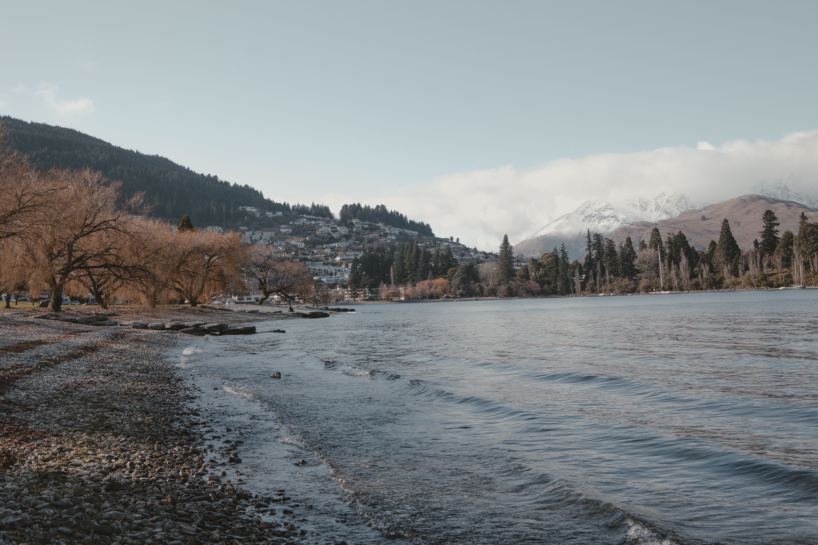 Unbeatable Queenstown: The Grand Circle Scenic Helicopter Flight Review Review 2026 - Explore the tranquil autumn landscape of Lake Wakatipu, Queenstown, surrounded by mountains and vibrant trees.