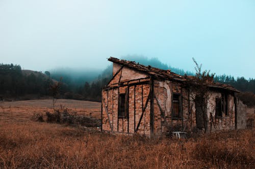 Free Old Abandoned House on a Pasture in the Valley Stock Photo