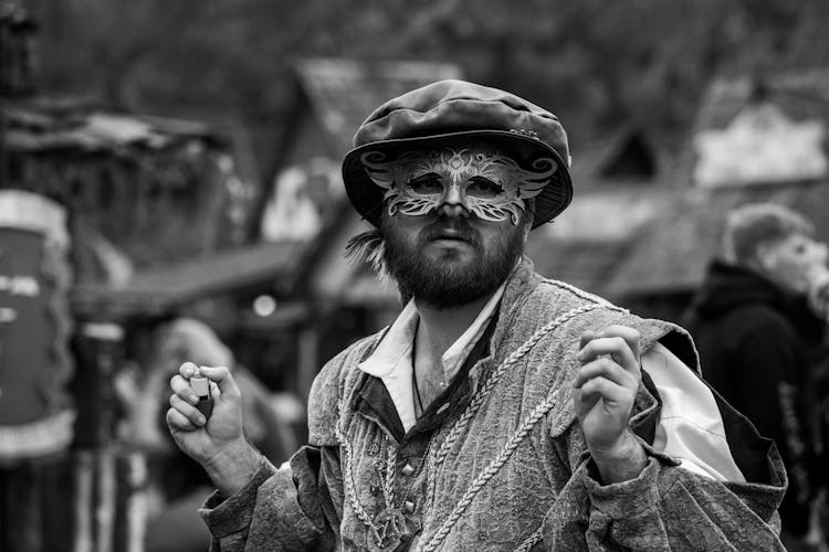 Man With Mask And Renaissance Costume At Reenactment Festival