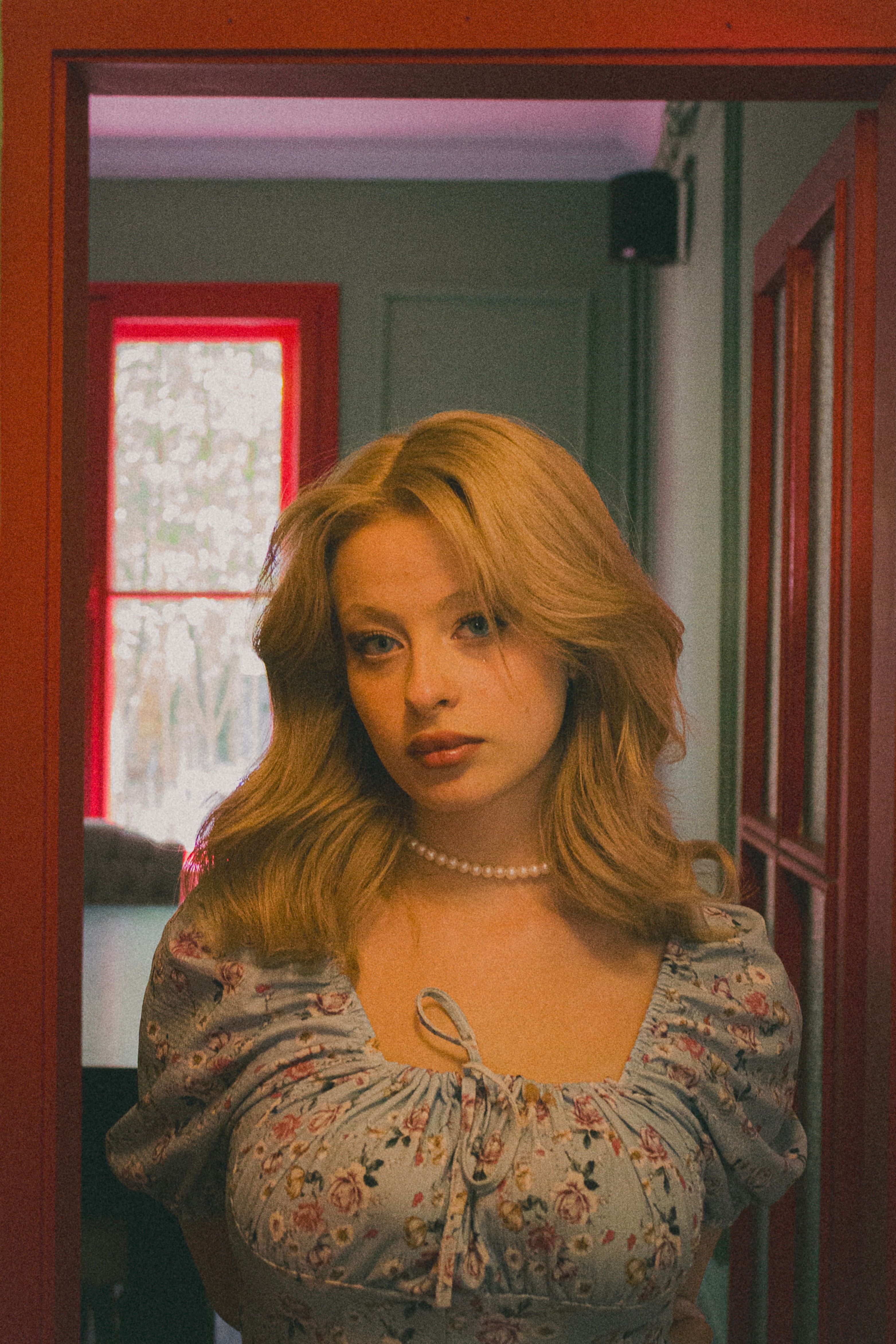 Elegant portrait of a blonde woman in Ankara, capturing a vintage aesthetic.
