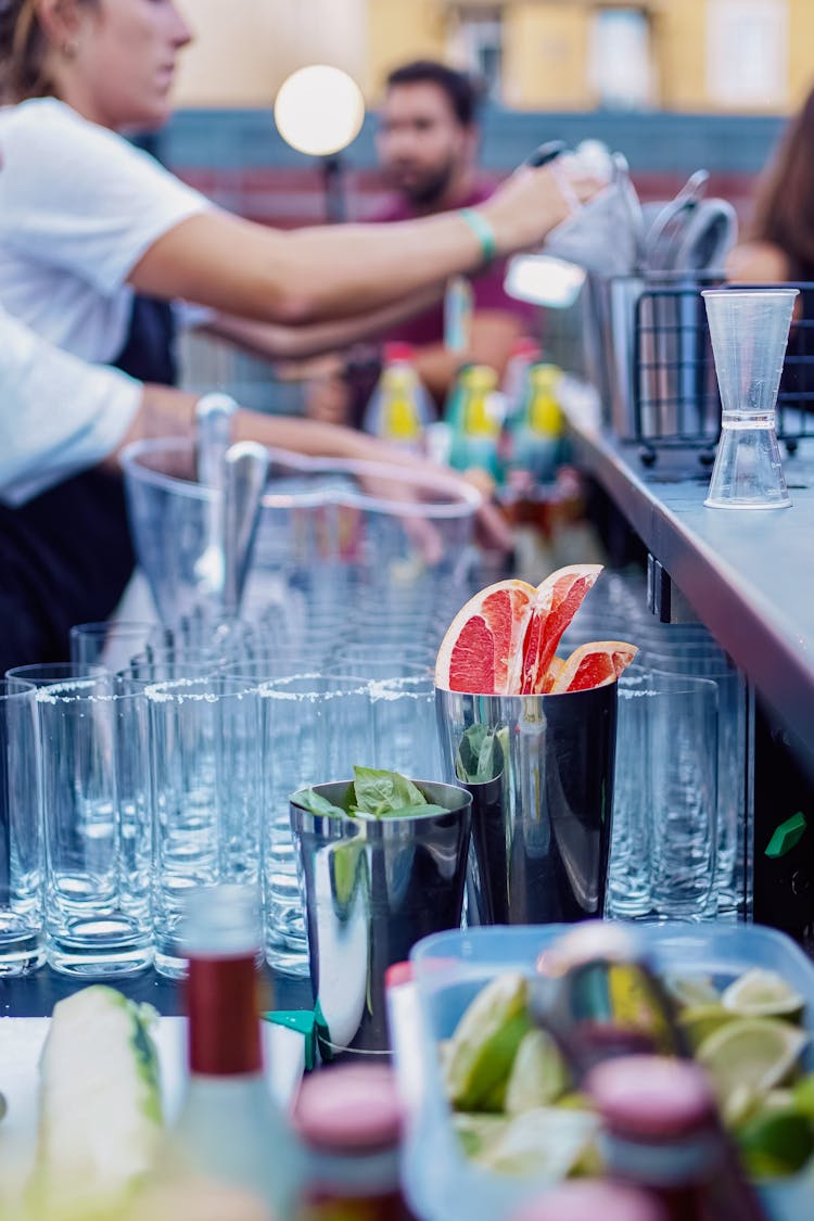 Woman Making Drinks At A Bar 