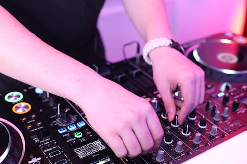 Close-up of DJ Using a Console
