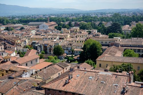 Free A stunning aerial view of the historic rooftops in Lucca, Tuscany, Italy, during a sunny day. Stock Photo
