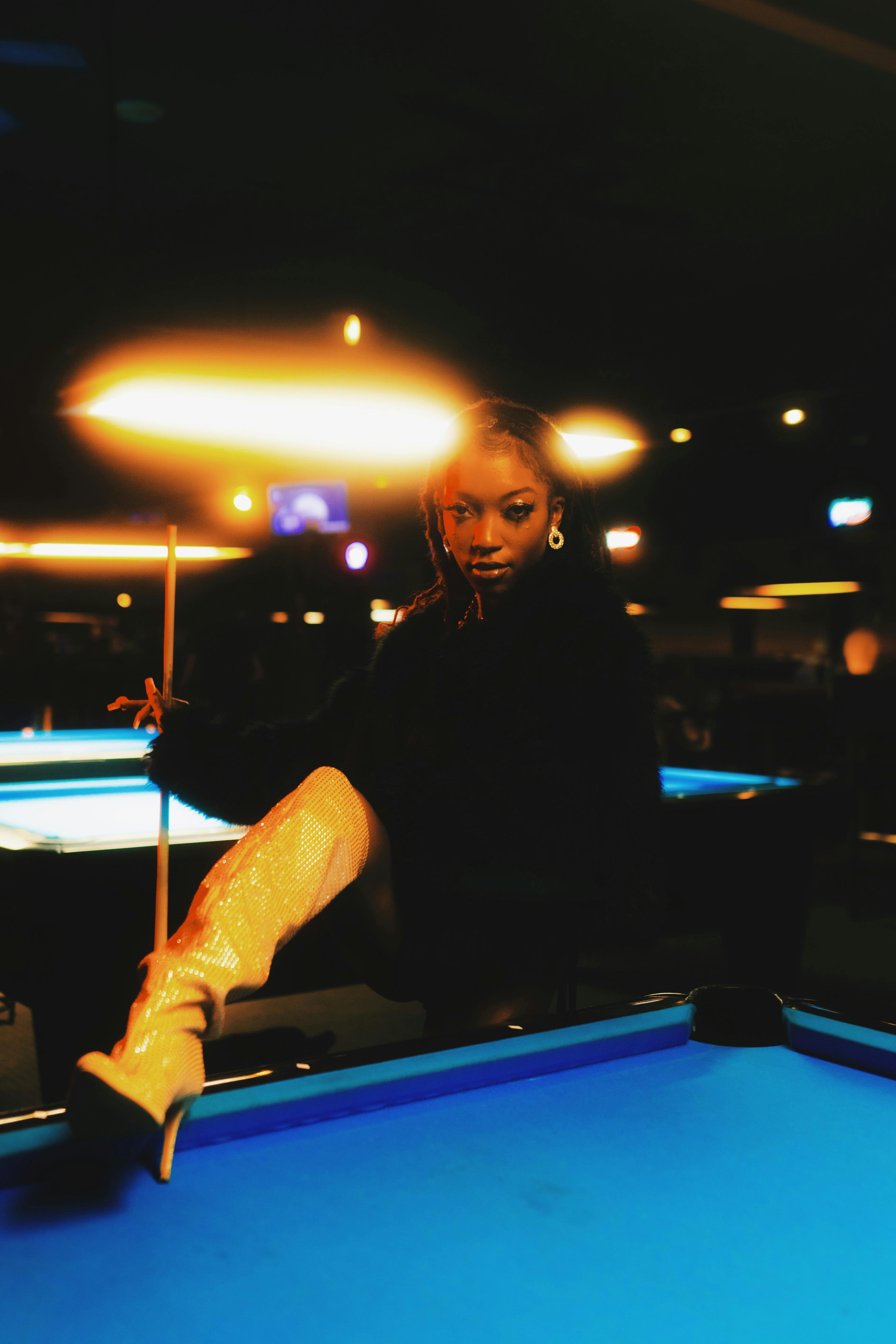 fashion women posing in a pool hall