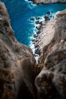 Stunning aerial view of rocky cliffs and azure waters on Zakynthos, Greece.