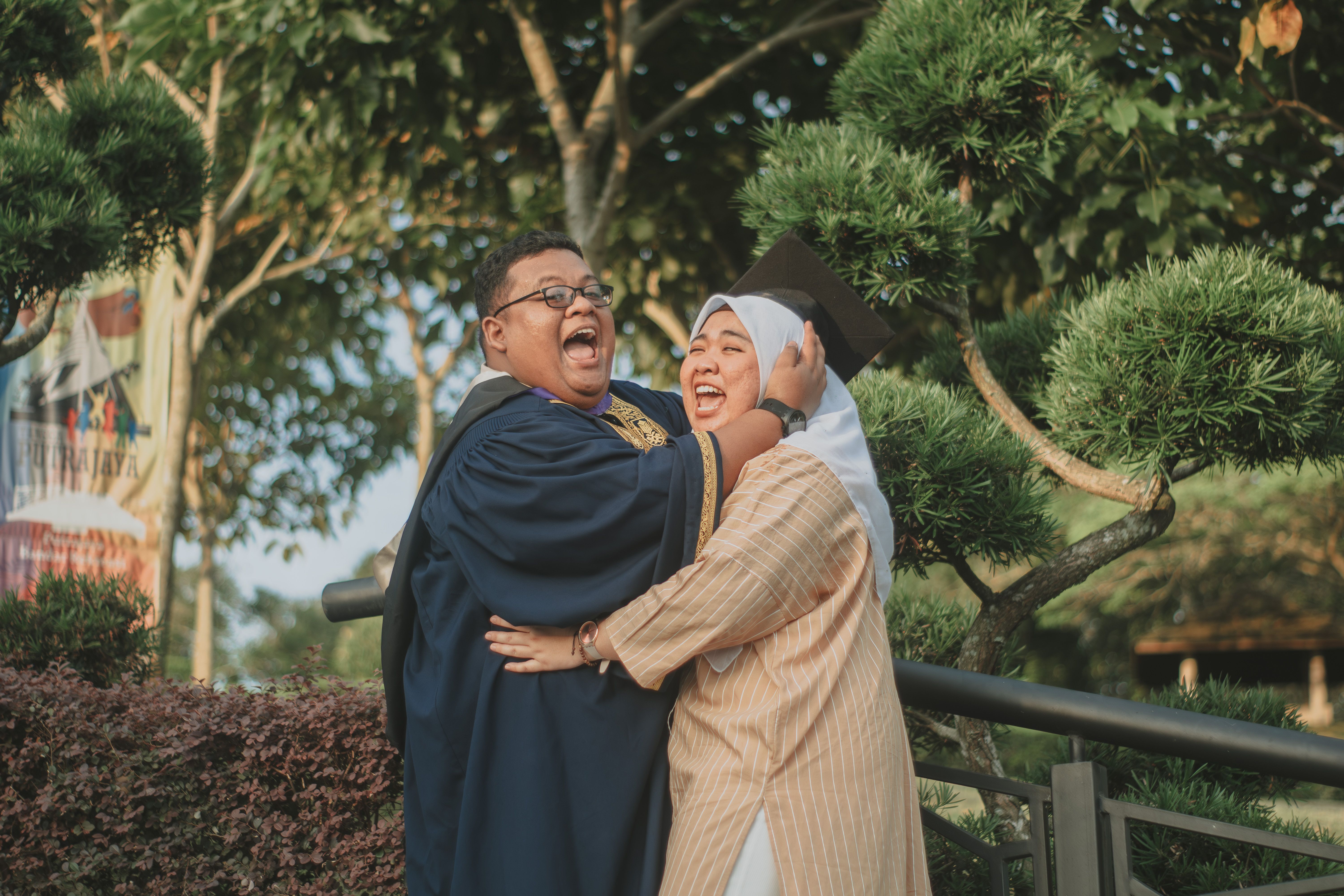 Couple in Traditional Clothing Hugging · Free Stock Photo