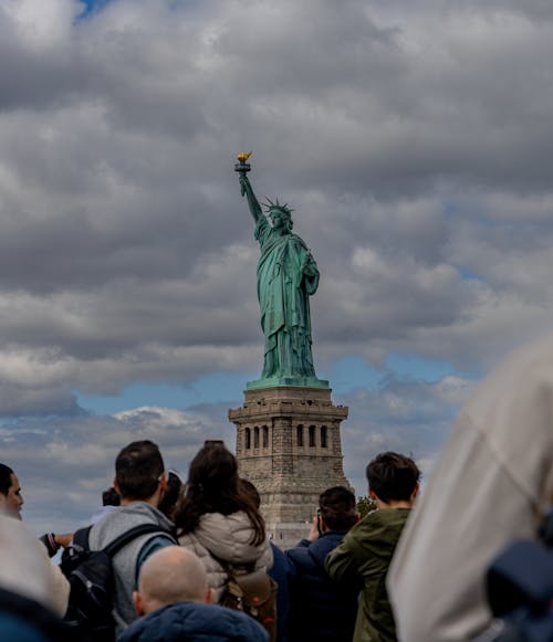 People Standing by Statue of Liberty in USA