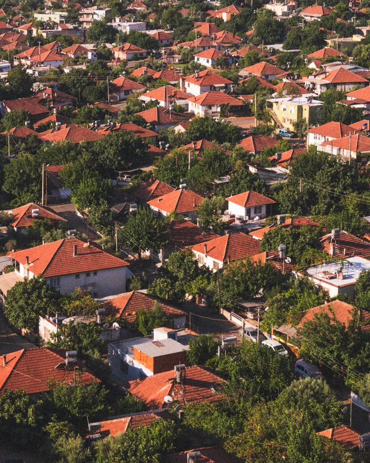 Refrigerator repair in Santee, CA Aerial view of a red-roofed suburb surrounded by greenery, like the Santee neighborhoods we serve
