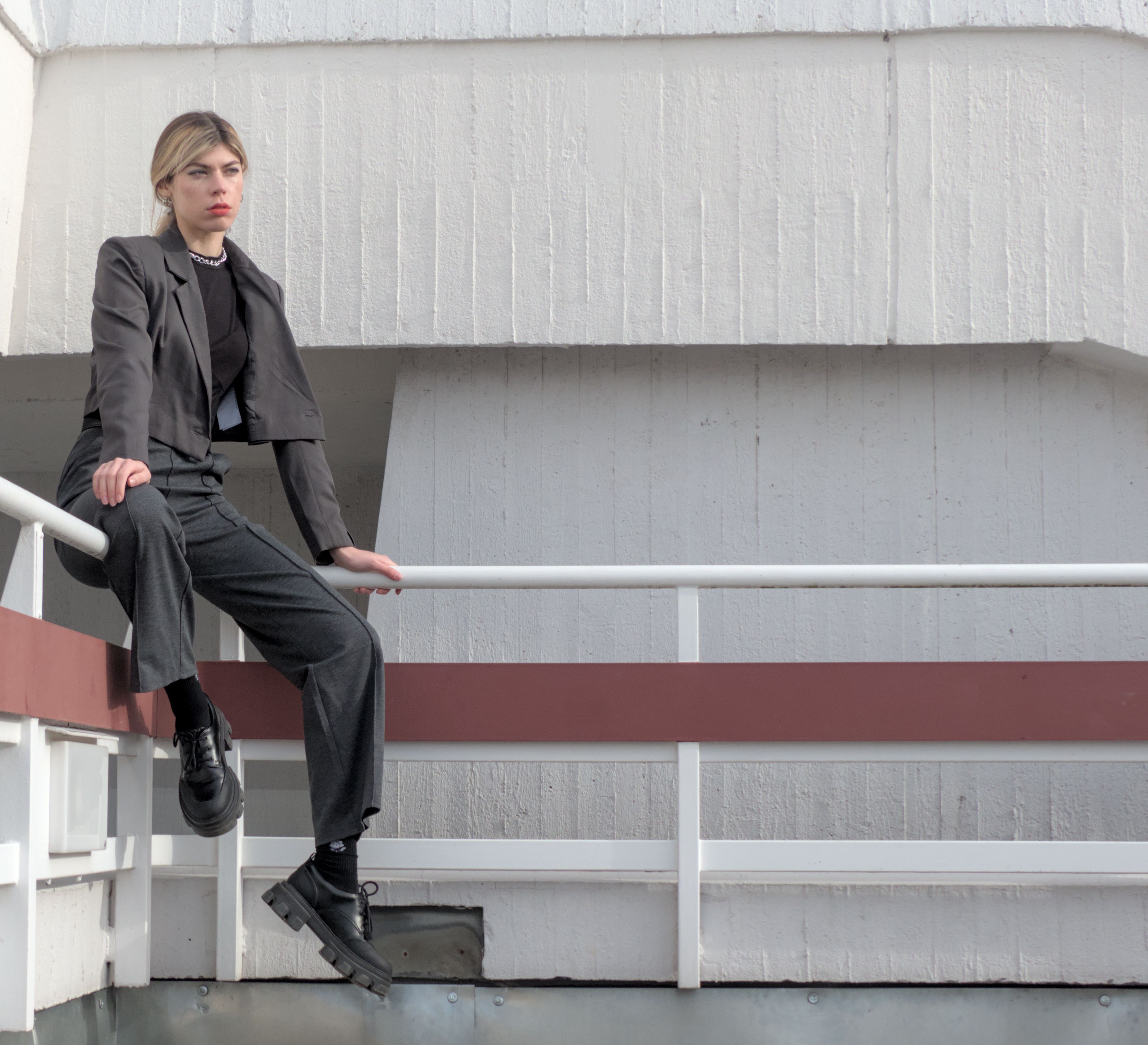Woman Sitting on the Railing · Free Stock Photo