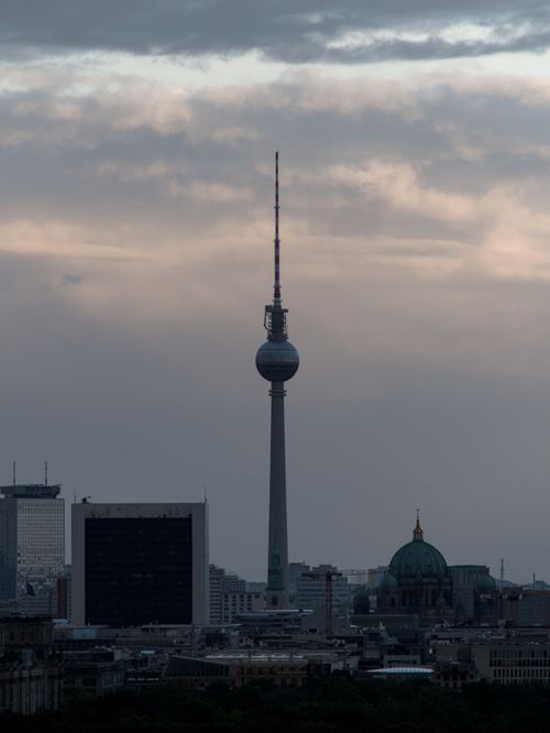 Free A scenic view of Berlin's skyline with the prominent Fernsehturm tower at dusk. Stock Photo