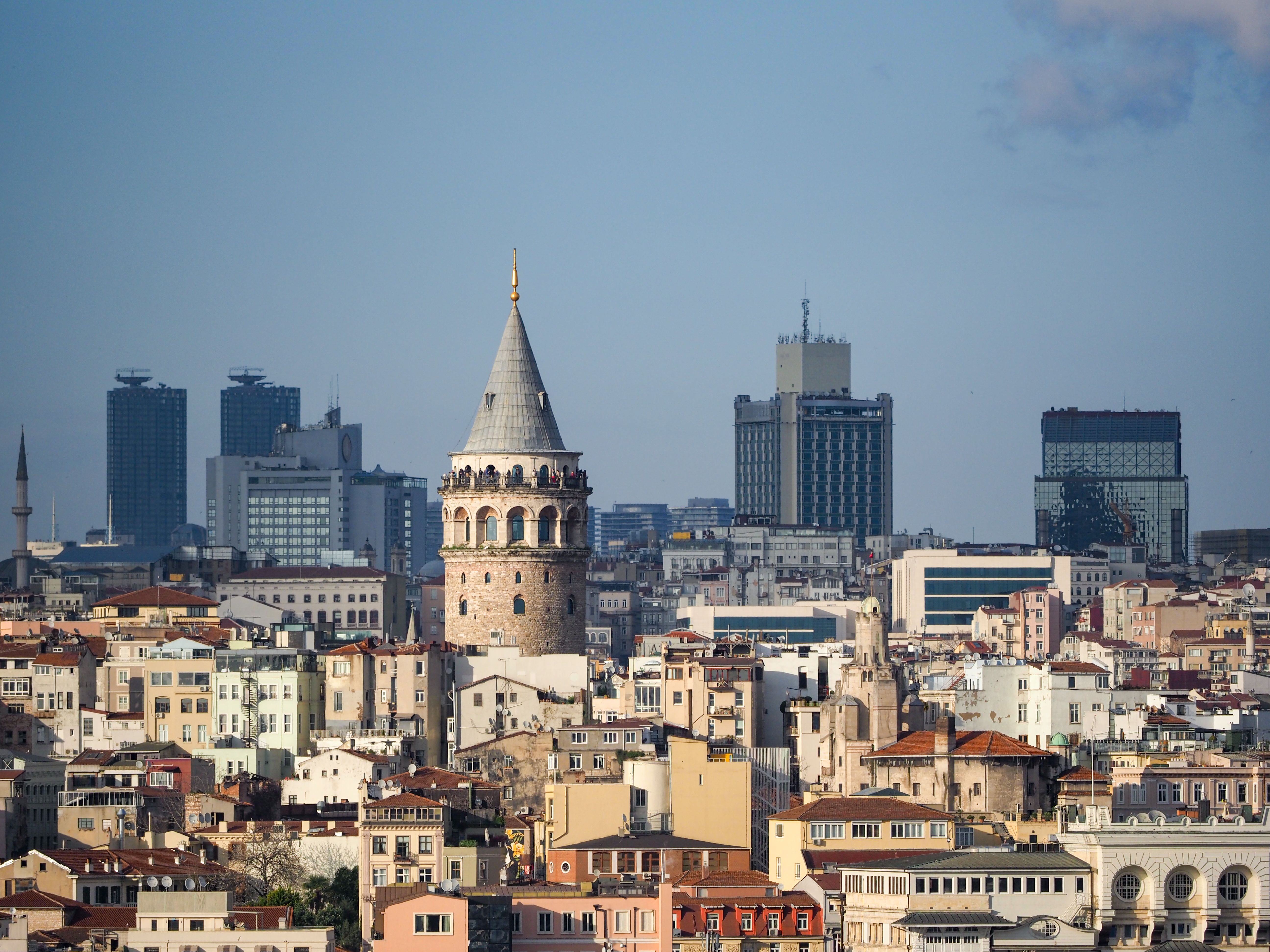 A breathtaking aerial view of the iconic Galata Tower amidst Istanbul's vibrant cityscape.