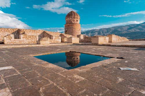 Ancient Ruins and Zeynel Bey Tomb Reflecting in a Pool