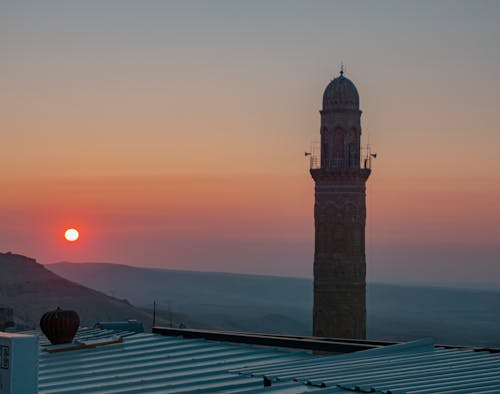 Minaret against a Pink Sky at Sunrise