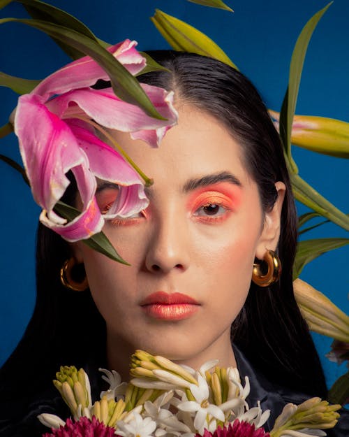 Portrait of a Young Brunette with Flowers around Her Face 