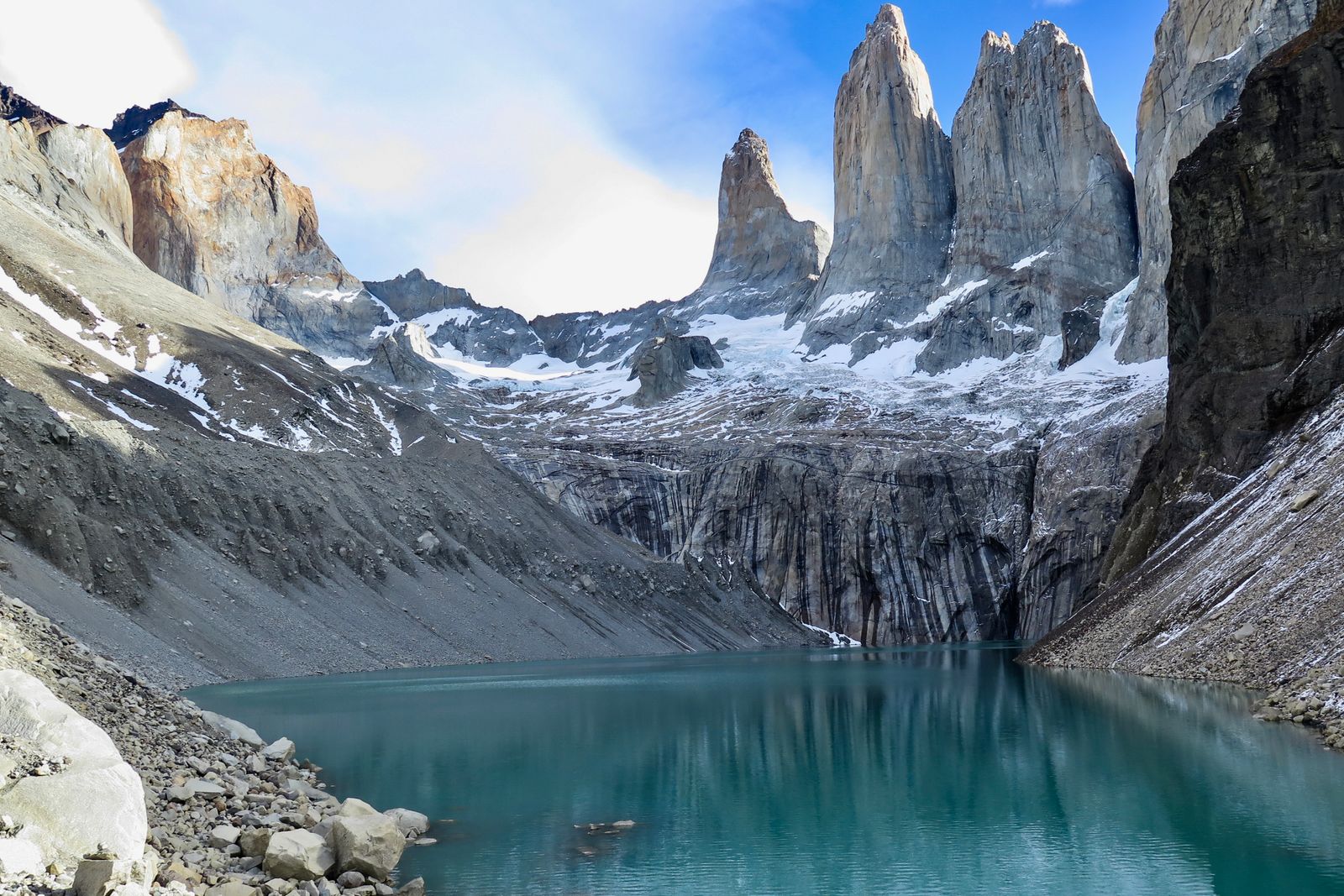 The granite towers of Torres del Paine rising above a turquoise glacial lake in Chilean Patagonia.