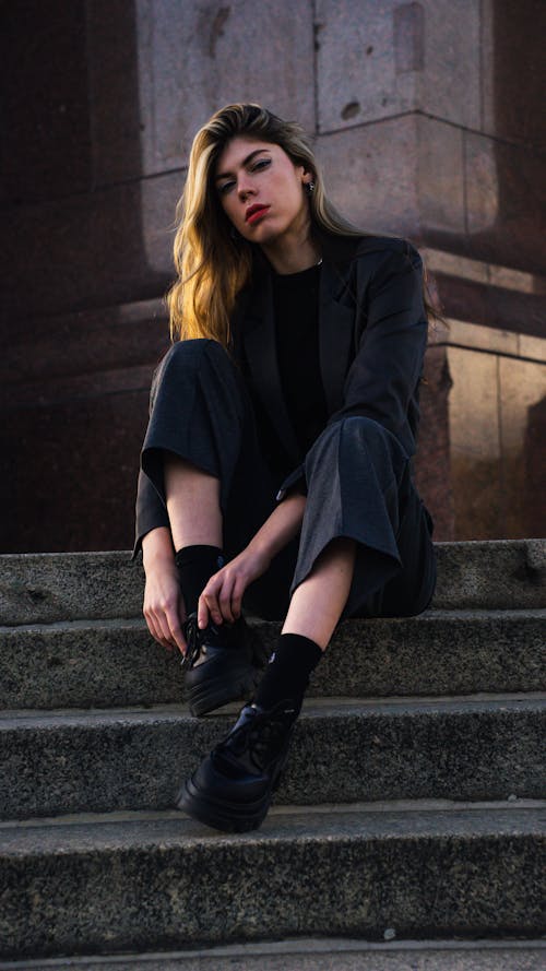 Model in Gray Suit Sitting on Stairs