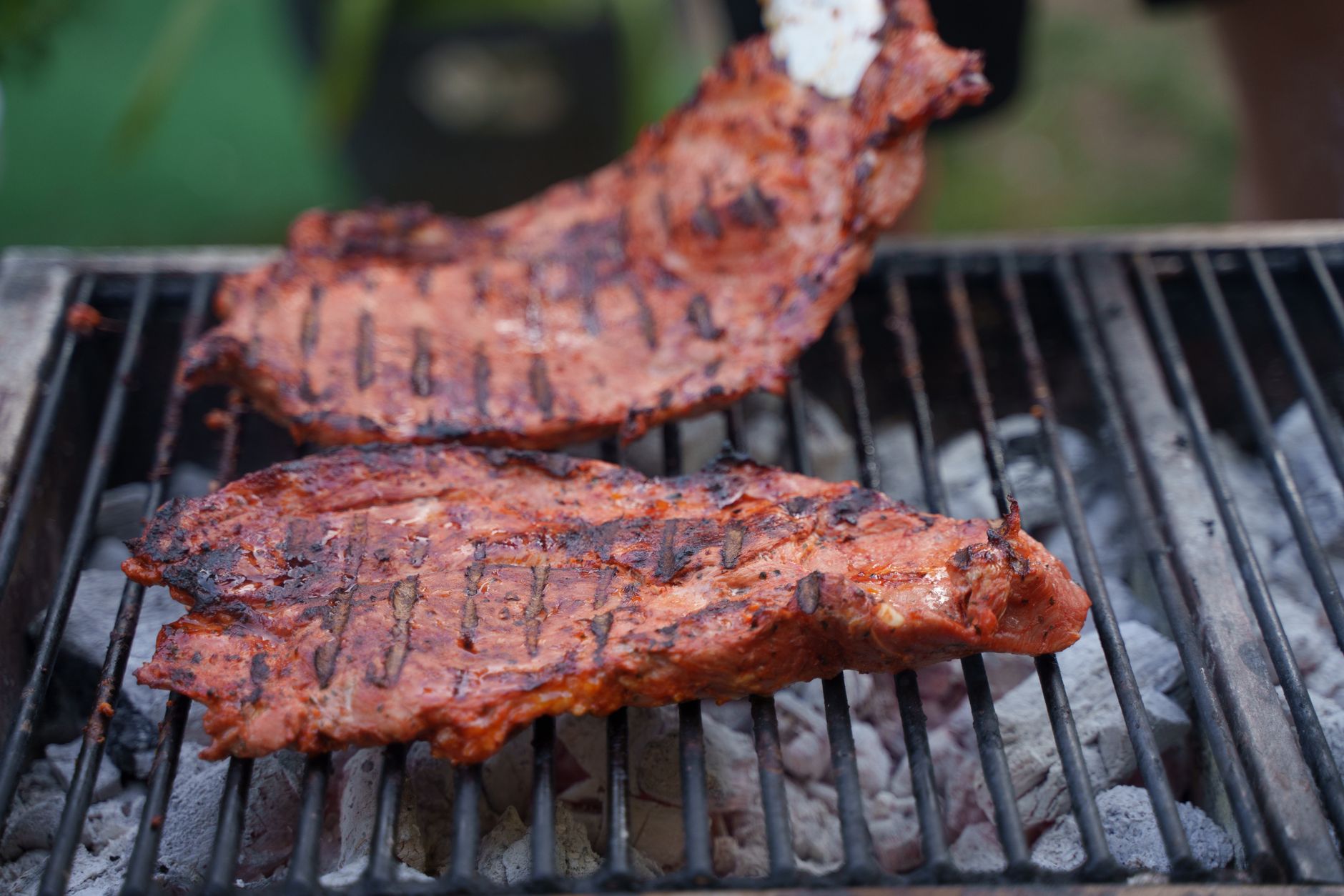 Serving BBQ sauce with grilled meat platter