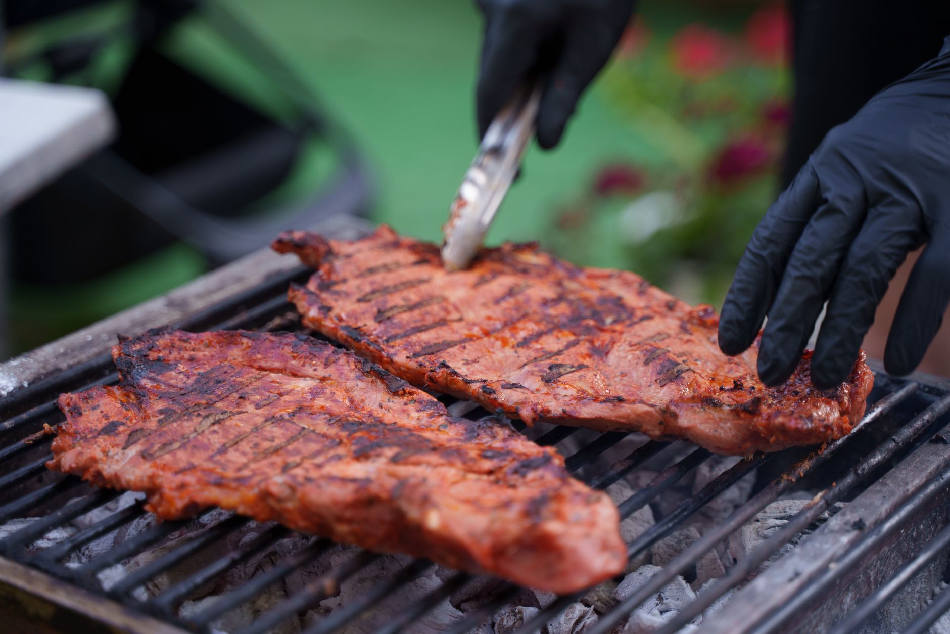 Close up of black and blue steak showing charred crust and rare center