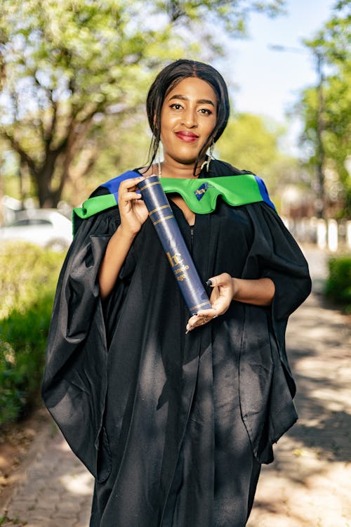 A Woman Standing with a Diploma