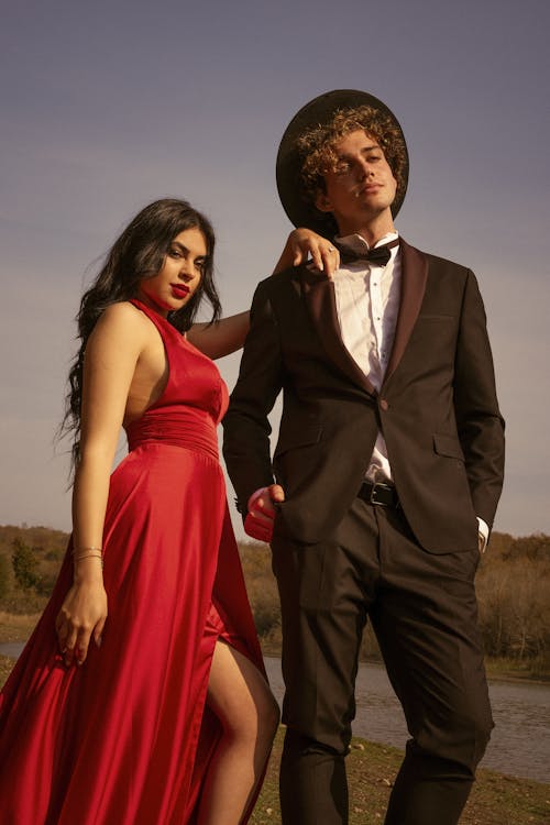 Models in Tuxedo and Red Wedding Dress