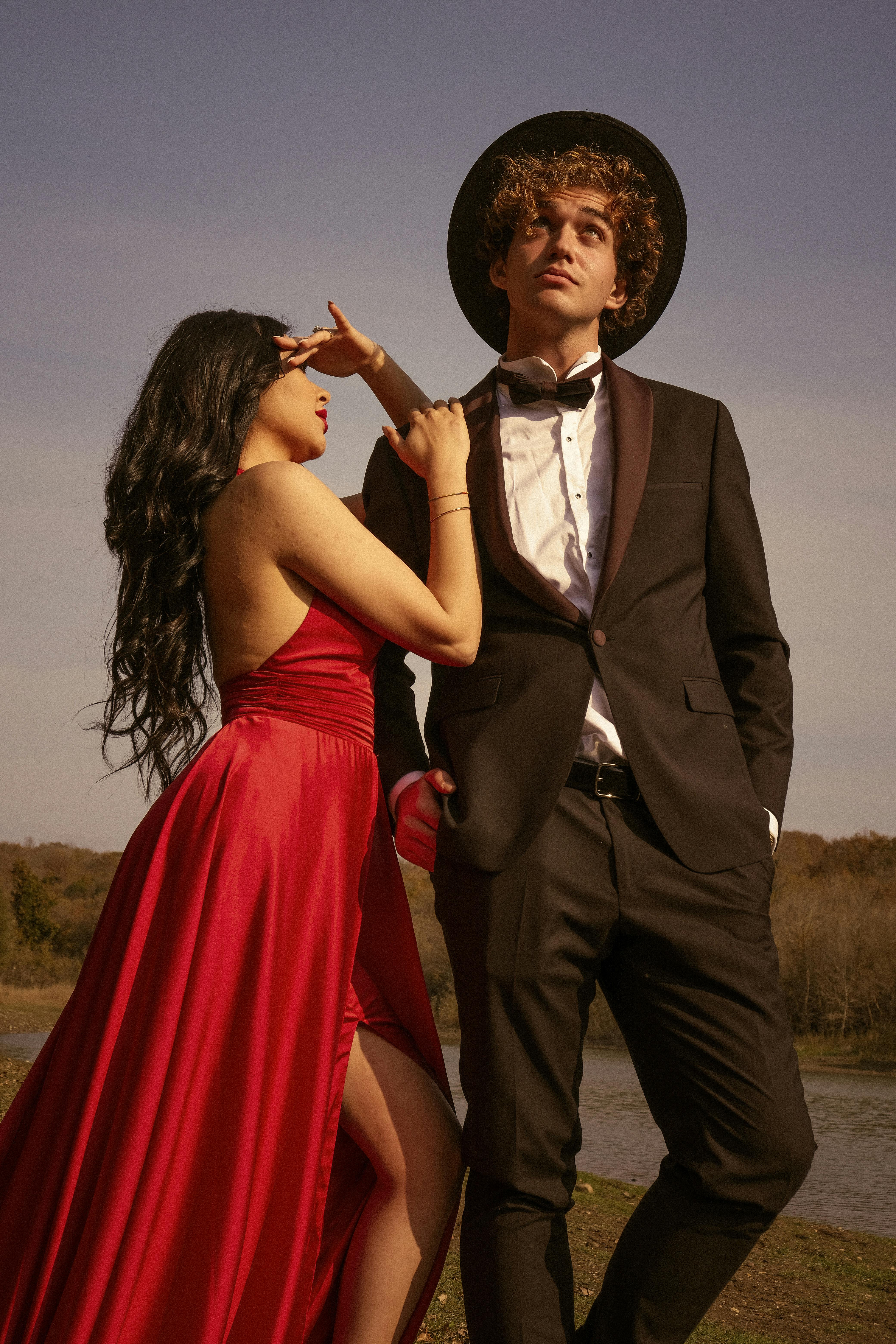 Free Photos - A Stylish Young Couple Posing Together In A Red Dress And A  Suit. Both Of Them Are Wearing Glasses, Which Adds To Their Chic  Appearance. They Seem To Be