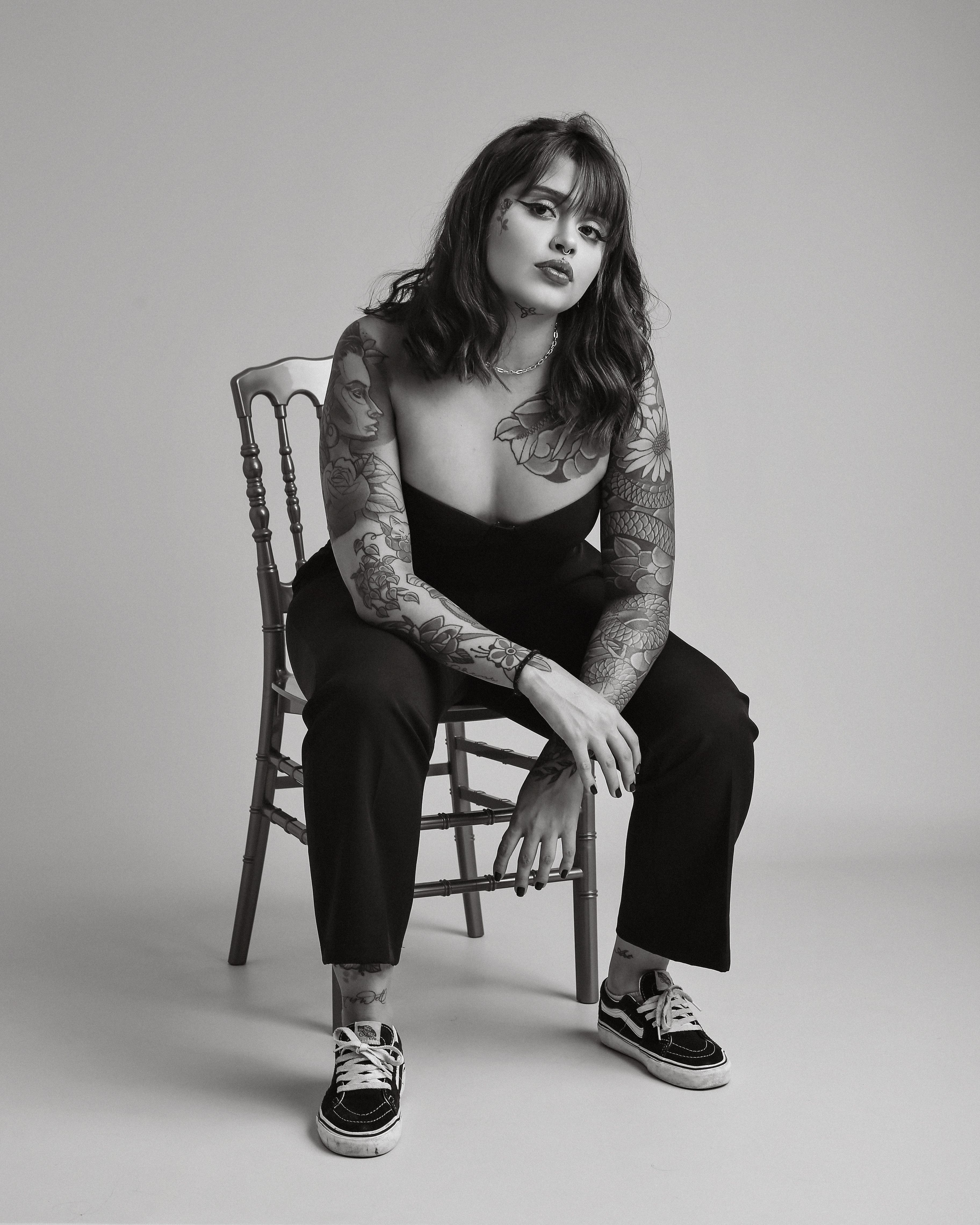 A Model Sitting on a Chair · Free Stock Photo