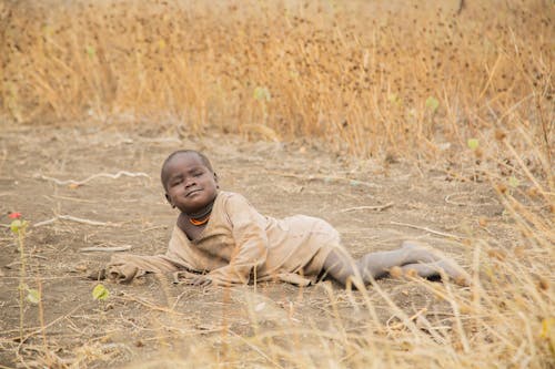 Kid Lying on Ground
