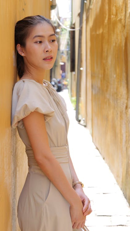 Young Model Posing in Sepia Blouse