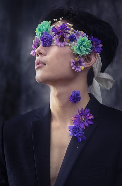 Young Model with a Blindfold and a Tuxedo Decorated with Flowers